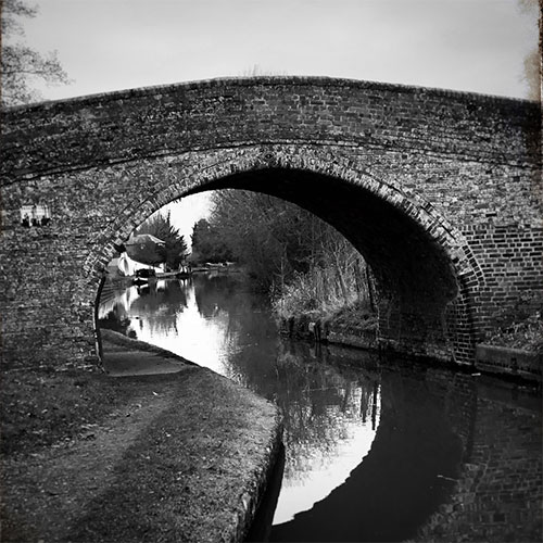 View of the canal through a bridge